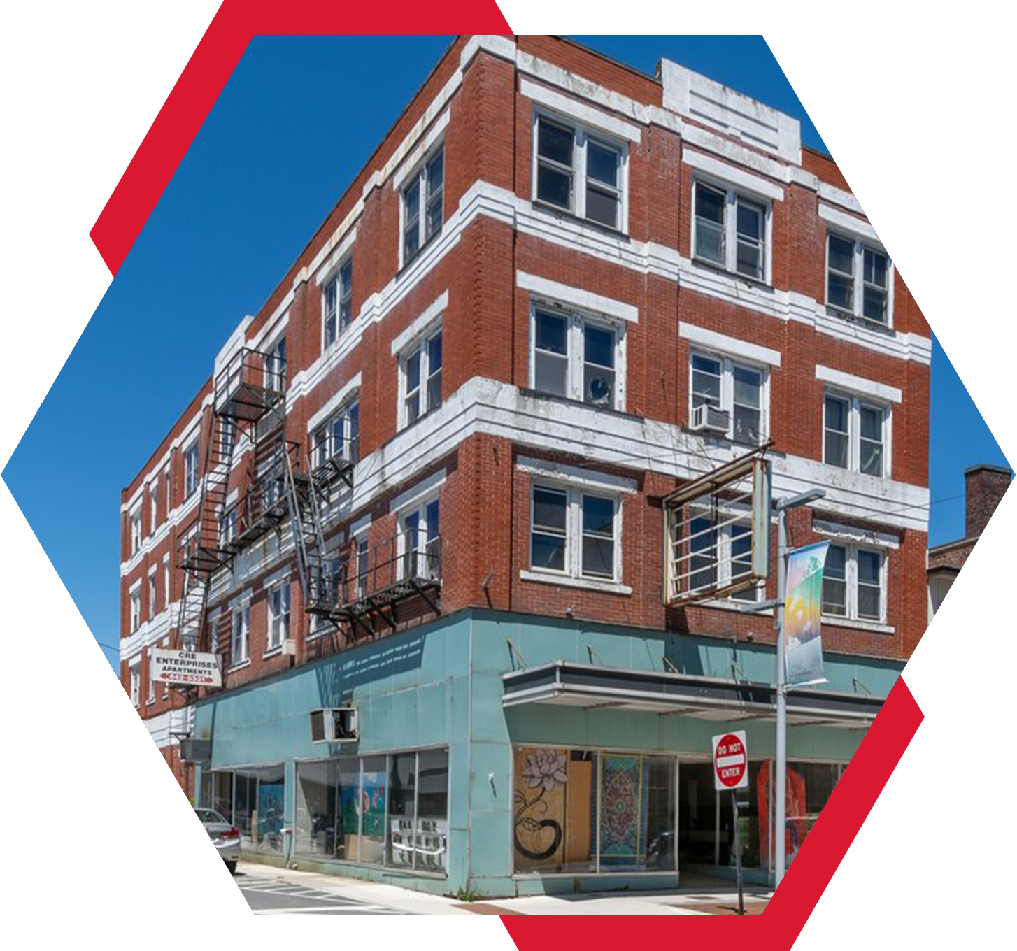 A building with a red and white stripe on the side of it.